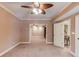 Spacious living room with neutral color and carpet flooring, and entrance ways to other rooms at 2748 Hidden Falls Dr, Buford, GA 30519