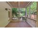 Relaxing screened porch with wood flooring and view of lush backyard at 2748 Hidden Falls Dr, Buford, GA 30519