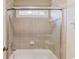 Enclosed shower features glass doors, tiled walls, and a shower head at 2748 Hidden Falls Dr, Buford, GA 30519