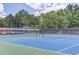 Outdoor tennis court with well-maintained surface at 2748 Hidden Falls Dr, Buford, GA 30519