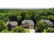 Aerial view showing a neighborhood with mature trees and homes with well-manicured lawns at 5059 Belair Bluff Se Ct, Smyrna, GA 30126