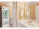 Bright bathroom with white vanity, modern fixtures, and large mirror and doorway to bedroom at 5059 Belair Bluff Se Ct, Smyrna, GA 30126