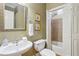 Bathroom with a shower over tub and a decorative mirror and wall art at 5059 Belair Bluff Se Ct, Smyrna, GA 30126