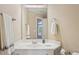 Bathroom with white vanity, modern fixtures, and large mirror at 5059 Belair Bluff Se Ct, Smyrna, GA 30126