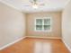Cozy bedroom featuring wood-look floors, a large window, and neutral wall color at 5059 Belair Bluff Se Ct, Smyrna, GA 30126