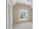 Bedroom features a large window providing natural light and neutral carpeting at 5059 Belair Bluff Se Ct, Smyrna, GA 30126