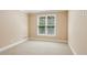 Neutral bedroom with carpet flooring, window with blind, and plenty of natural light at 5059 Belair Bluff Se Ct, Smyrna, GA 30126