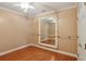 Bonus room with wooden floors and large mirror at 5059 Belair Bluff Se Ct, Smyrna, GA 30126