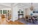 Elegant dining room with hardwood floors, a large table, and decorative lighting at 5059 Belair Bluff Se Ct, Smyrna, GA 30126