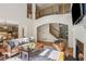 Open-concept living room with soaring ceilings, a fireplace, and hardwood floors at 5059 Belair Bluff Se Ct, Smyrna, GA 30126