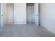 Bedroom with neutral carpet and paint, walk-in closet, and white doors at 904 Sundown Pt, Villa Rica, GA 30180