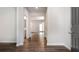 Inviting entryway with dark wood flooring, neutral walls, and views into other rooms of the home at 904 Sundown Pt, Villa Rica, GA 30180