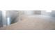 Upstairs hallway with carpet flooring and railing on stairway to downstairs at 904 Sundown Pt, Villa Rica, GA 30180