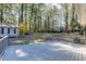Back deck overlooks a lush, wooded lot and small guest house at 1373 W Prospect Dr, Lawrenceville, GA 30043