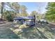 Spacious backyard with a deck, mature trees, and plenty of green space at 1373 W Prospect Dr, Lawrenceville, GA 30043