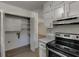 Well-organized kitchen with modern appliances and ample storage space, including shelving and a pantry closet at 1373 W Prospect Dr, Lawrenceville, GA 30043