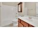Bathroom with single sink vanity and a shower-tub combo at 1550 Rolling View Dr, Cumming, GA 30040