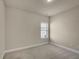 Neutral bedroom with carpet and a bright window at 1550 Rolling View Dr, Cumming, GA 30040