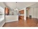 Bright kitchen with stone counters and stainless steel appliances flowing to a dining space at 1550 Rolling View Dr, Cumming, GA 30040