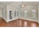 Bright living room featuring beautiful hardwood floors and multiple windows at 1550 Rolling View Dr, Cumming, GA 30040