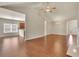 Open-concept living room boasts hardwood floors and ample natural light at 1550 Rolling View Dr, Cumming, GA 30040
