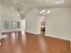 Hardwood flooring and vaulted ceilings create a bright open space in this home's living area at 1550 Rolling View Dr, Cumming, GA 30040
