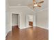 Spacious main bedroom featuring hardwood floors and an en suite bathroom at 1550 Rolling View Dr, Cumming, GA 30040