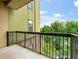 Balcony with black metal railings overlooking lush green trees at 425 Chapel Sw St # 1211, Atlanta, GA 30313