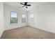 Bright bedroom featuring neutral carpet and multiple windows at 425 Chapel Sw St # 1211, Atlanta, GA 30313
