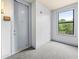 Entry to apartment with carpeted floors, window, and trim at 425 Chapel Sw St # 1211, Atlanta, GA 30313