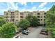View of apartment building with parking area and landscaping at 425 Chapel Sw St # 1211, Atlanta, GA 30313