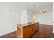 Kitchen island with granite countertop and overhead pendant lights at 425 Chapel Sw St # 1211, Atlanta, GA 30313