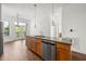 Open kitchen with granite countertops and stainless steel dishwasher at 425 Chapel Sw St # 1211, Atlanta, GA 30313
