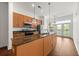 Kitchen with stainless steel appliances, island, and view of the balcony at 425 Chapel Sw St # 1211, Atlanta, GA 30313