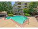 Sparkling outdoor pool, perfect for relaxation and recreation, with a beautiful building in the background at 425 Chapel Sw St # 1211, Atlanta, GA 30313