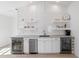 Chic bar area featuring a beverage fridge, floating shelves, and stylish backsplash for entertaining at 6820 Colfax Ave, Cumming, GA 30040