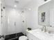 Modern bathroom with a glass-enclosed shower, stylish vanity, and sleek fixtures offer a spa-like experience at 6820 Colfax Ave, Cumming, GA 30040