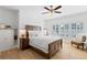 Cozy bedroom with a large bed, built-in cabinets, and bright windows at 6820 Colfax Ave, Cumming, GA 30040