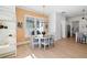 Bright dining room with modern chandelier, stylish seating, and sunny windows at 6820 Colfax Ave, Cumming, GA 30040