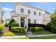 Charming two-story home featuring a covered entrance, complemented by manicured shrubs and a well-maintained lawn at 6820 Colfax Ave, Cumming, GA 30040