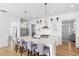 Well-lit kitchen with a large island, stainless steel appliances, and open layout at 6820 Colfax Ave, Cumming, GA 30040