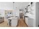 Open-concept kitchen with a large island, stainless steel appliances, and dining area view at 6820 Colfax Ave, Cumming, GA 30040