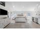 Bright and airy main bedroom with wet bar, hardwood floors, and shiplap accents create a luxurious retreat at 6820 Colfax Ave, Cumming, GA 30040