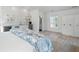 Luxurious primary suite with a wet bar, mini fridge, shiplap accents, and stylish decor at 6820 Colfax Ave, Cumming, GA 30040