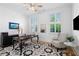 Charming home office featuring large windows, decorative rug, and classic furnishings at 6820 Colfax Ave, Cumming, GA 30040