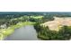 Breathtaking aerial view of the golf course, lake, trees and planned home developments at 910 Sundown Pt, Villa Rica, GA 30180