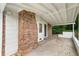 Covered back patio with brick column, offering a shady outdoor space at 2775 Belleau Se Ln, Atlanta, GA 30316