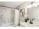 Updated bathroom with marble tile, modern vanity, and stylish lighting at 2775 Belleau Se Ln, Atlanta, GA 30316
