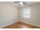 Empty bedroom featuring hardwood floors, neutral walls, and a sunlit window at 2775 Belleau Se Ln, Atlanta, GA 30316