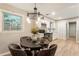 Cozy dining area featuring hardwood floors, a chandelier, and a window that provides natural light at 2775 Belleau Se Ln, Atlanta, GA 30316